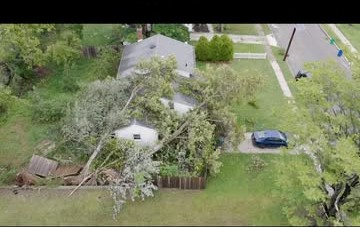 Aerial view of storm damage from a fallen tree on a residential property
